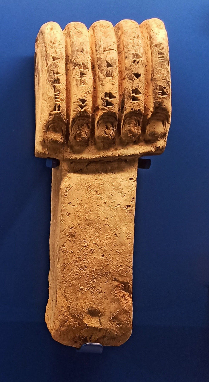 Hand of Ishtar, c. 870 BCE, from Ashurnasirpal's palace at Nimrud, an Assyrian votive object inscribed in cuneiform.