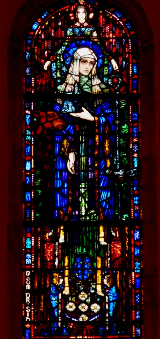 Harry Clarke's 1915 stained-glass St. Brigid, from the Irish Celtic Revival tradition that merges the goddess's memory with the saint's.