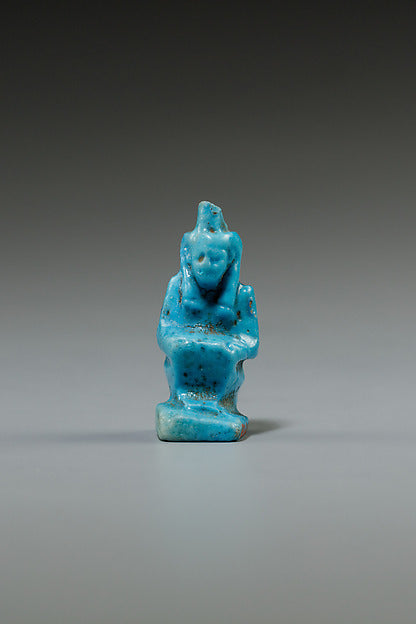 Blue faience amulet of Ma'at, 664–30 BCE, seated with her feather, worn as a protective charm.