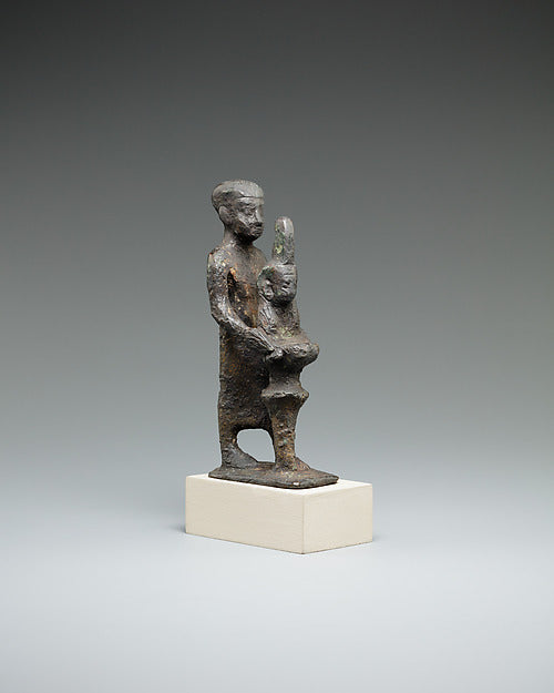 Bronze figure, 664–30 BCE, of an individual holding a Ma'at bust on a stand, offering truth.